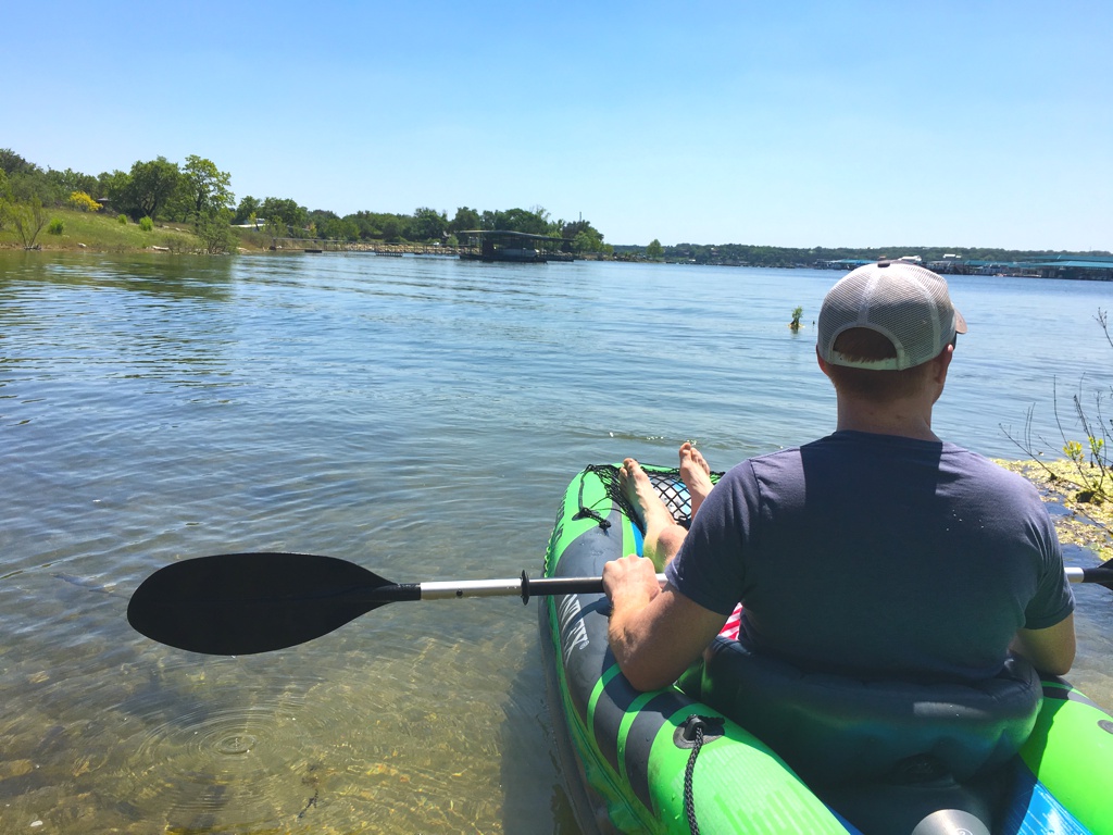 Heath sitting in a kayak on the water.