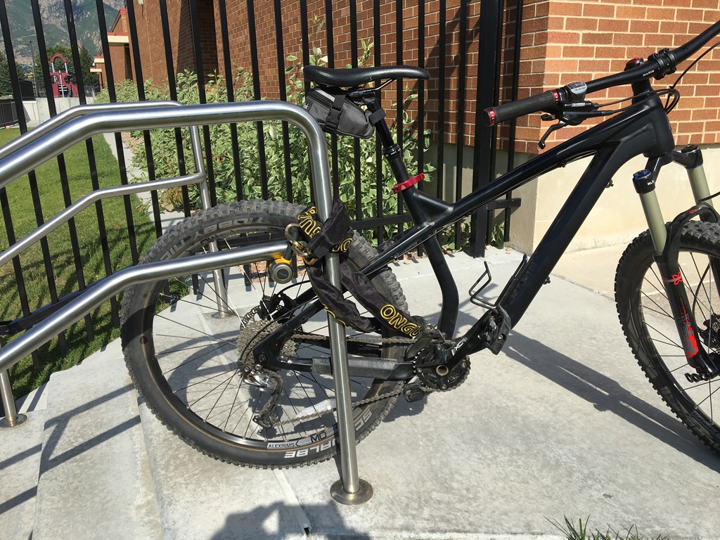 Bike locked to a rail with heavy duty lock.