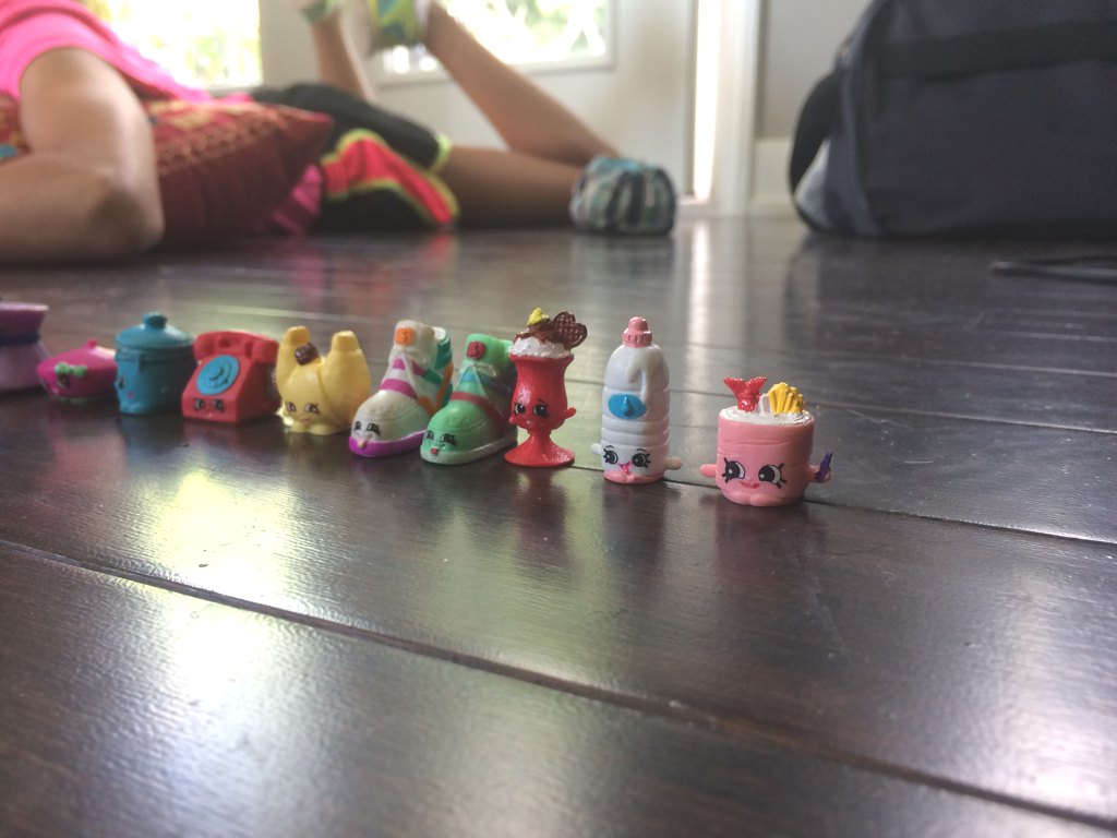Child playing with toys on the floor.