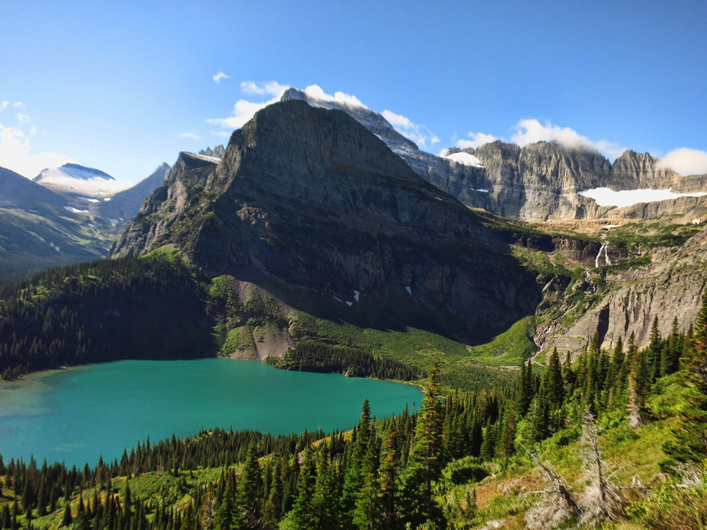 Lake, trees, mountains and Grinnell glacier.
