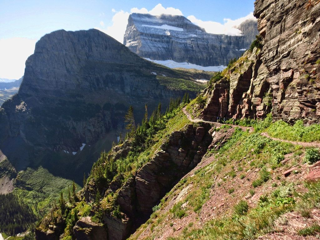 Narrow hiking path along the mountainside leading to the glacier.