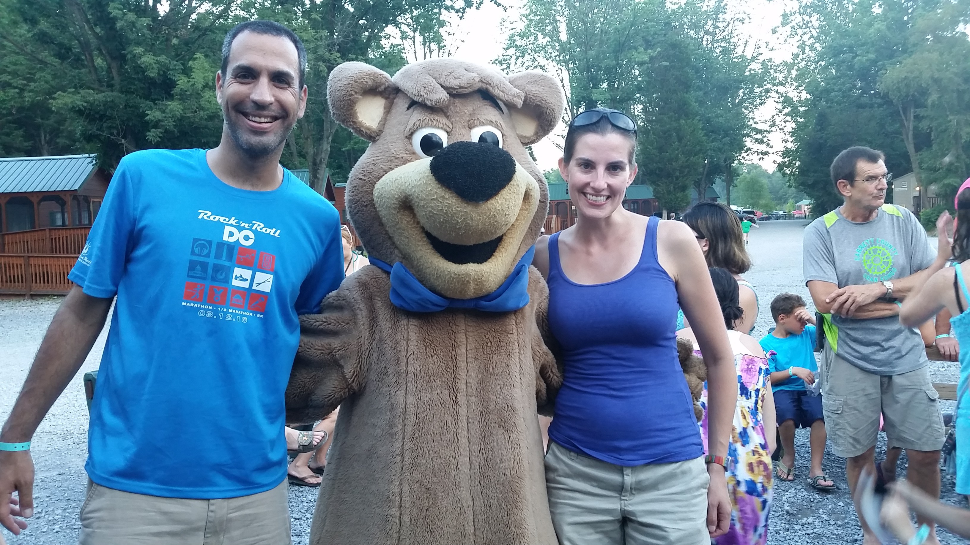 Alan and Lindy posing with person in Yogi Bear costume.