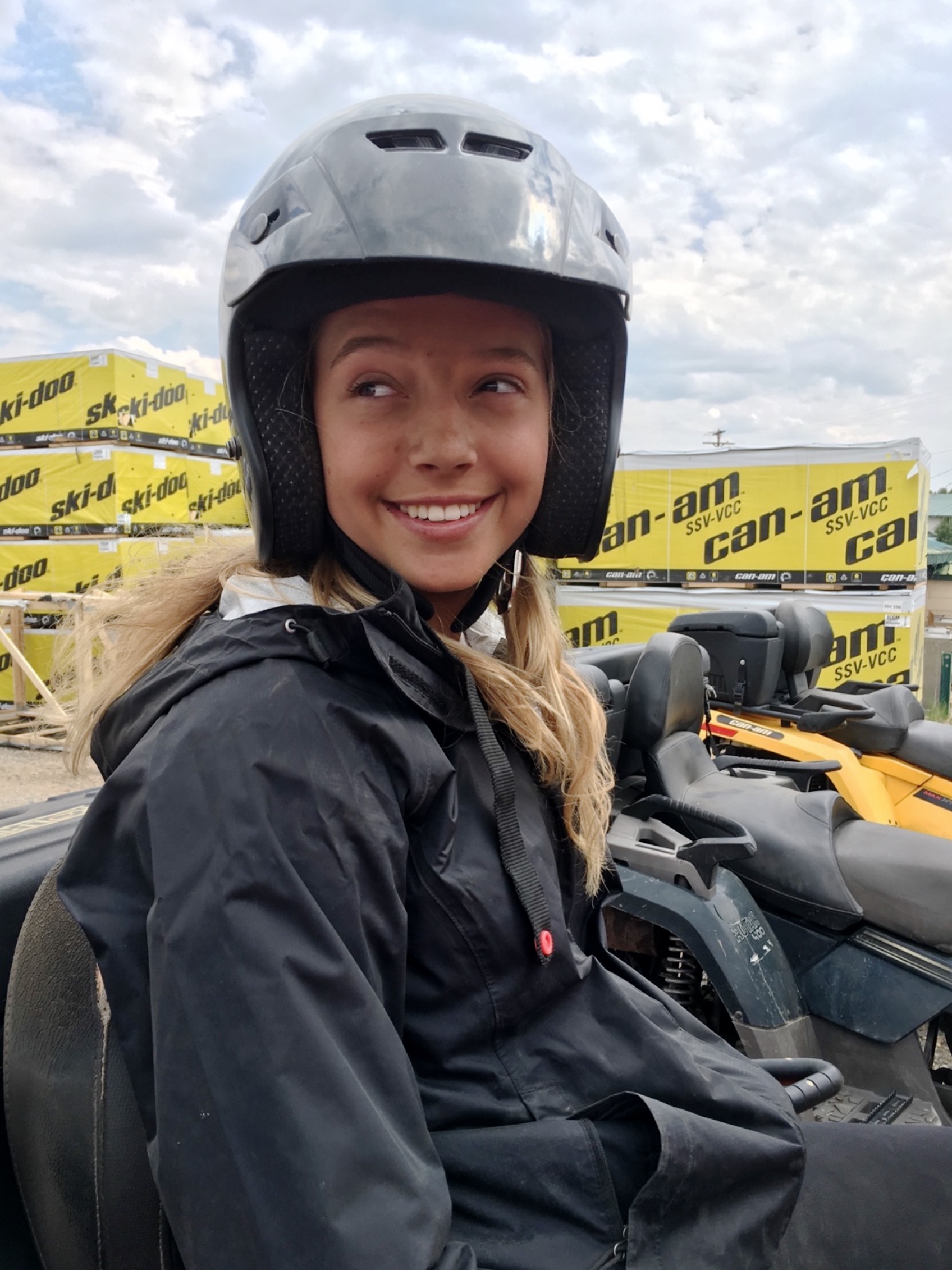 Girl with helmet on smiling.