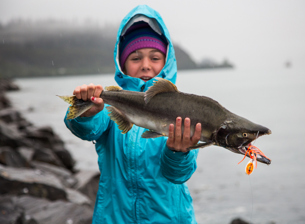 Abby holding a large salmon.