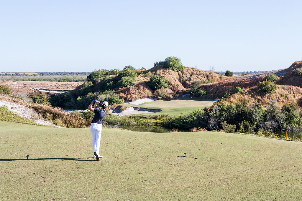 Jordan teeing off on a beautiful golf course.