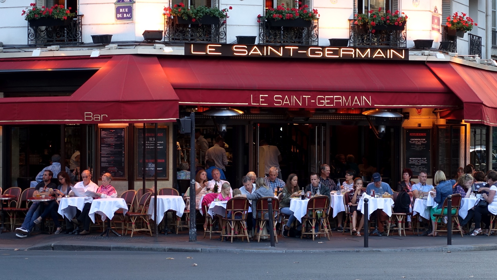 Restaurant goers enjoy a meal at Le Saint-Germain