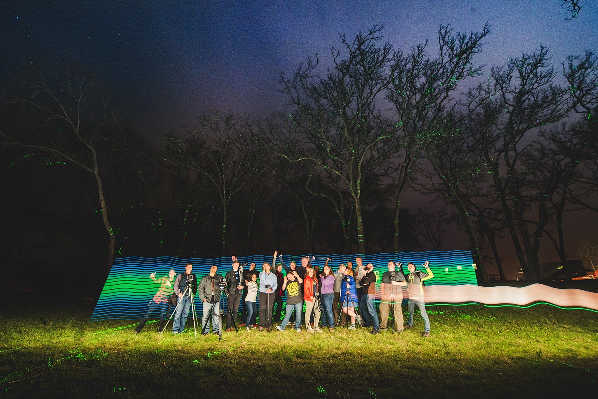 Photo of a group at night with unique lighting.