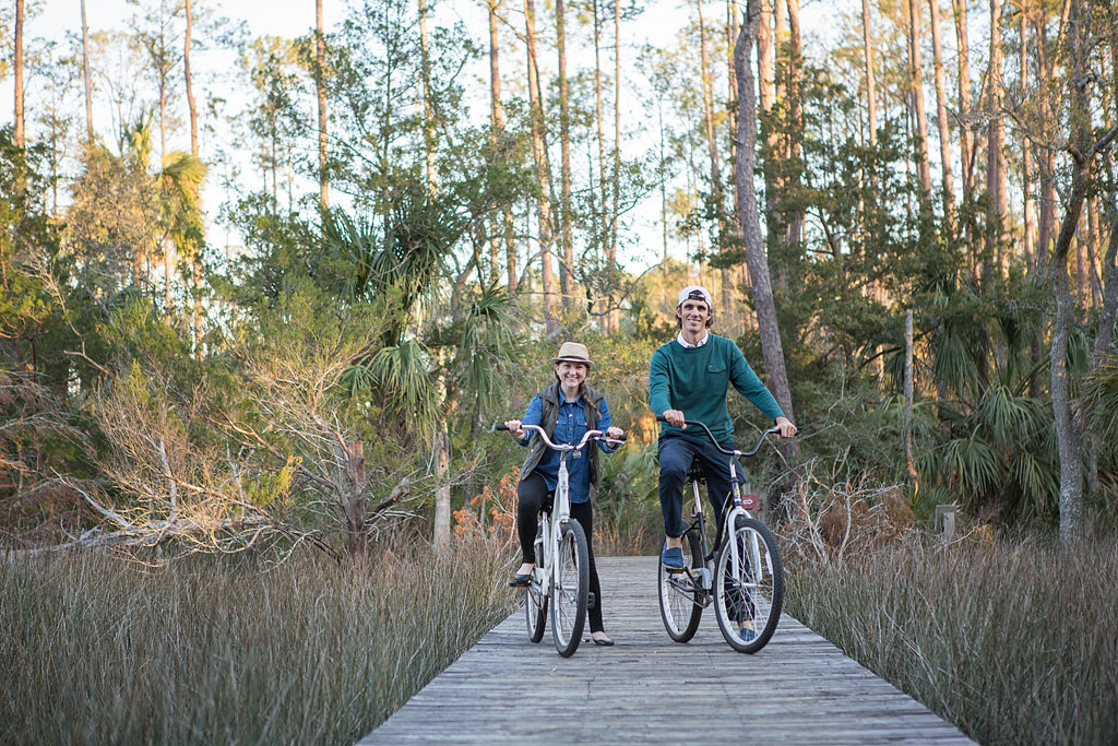 Jordan and Brittany riding bikes along a bike path.