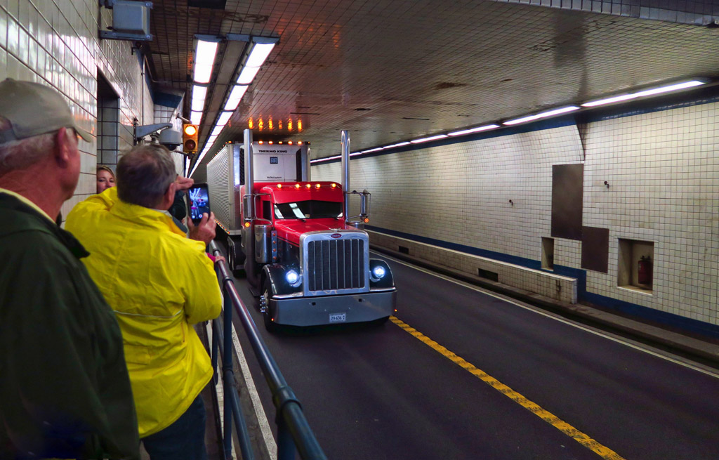 Large semi truck passing through narrow Chesapeake Bay Bridge Tunnel.