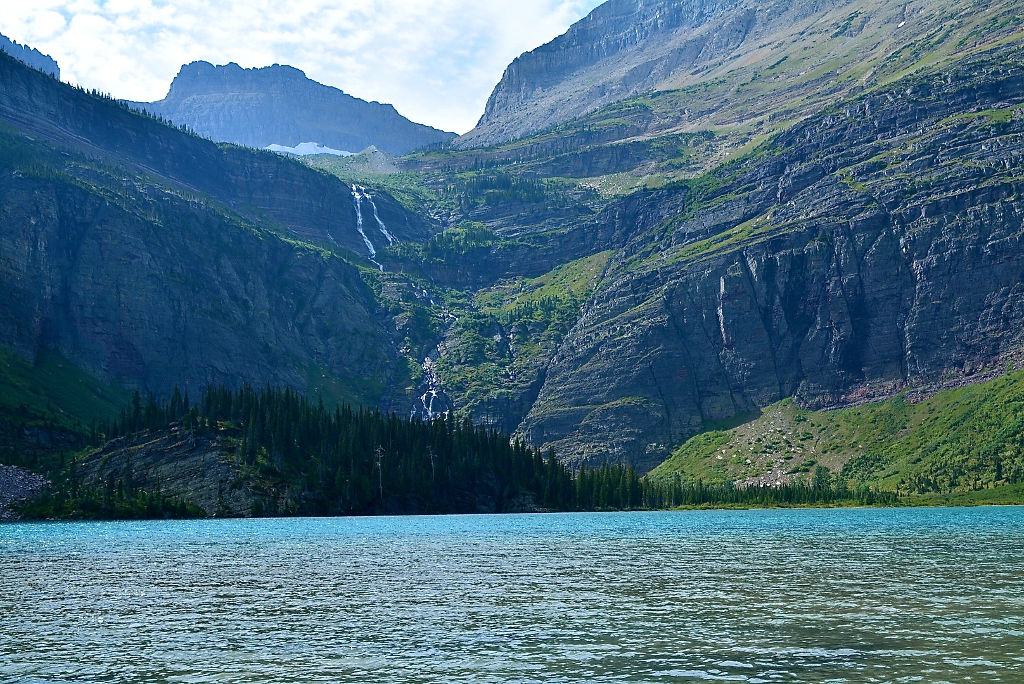 Water cascading down the mountainside into Grinnell Lake.