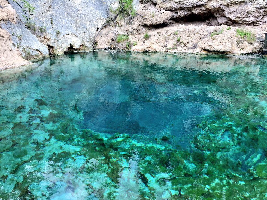Crystal clear blue water in basin.