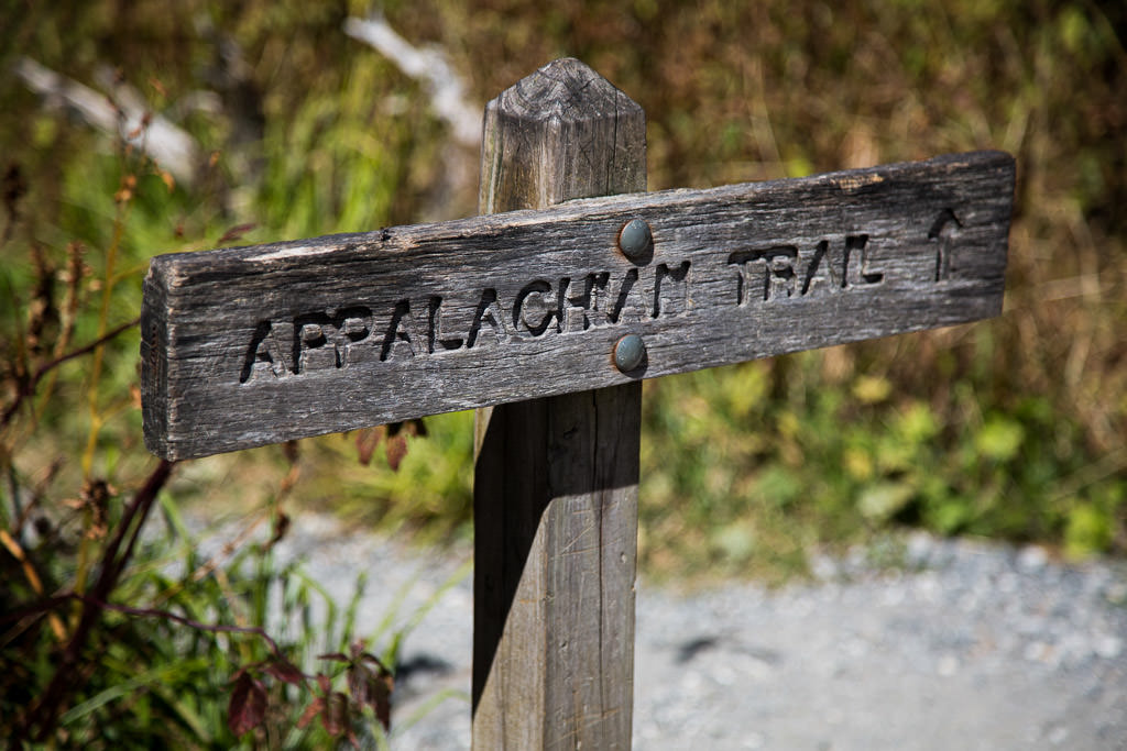 Sign that reads "Appalachian Trail" pointing ahead to a path.