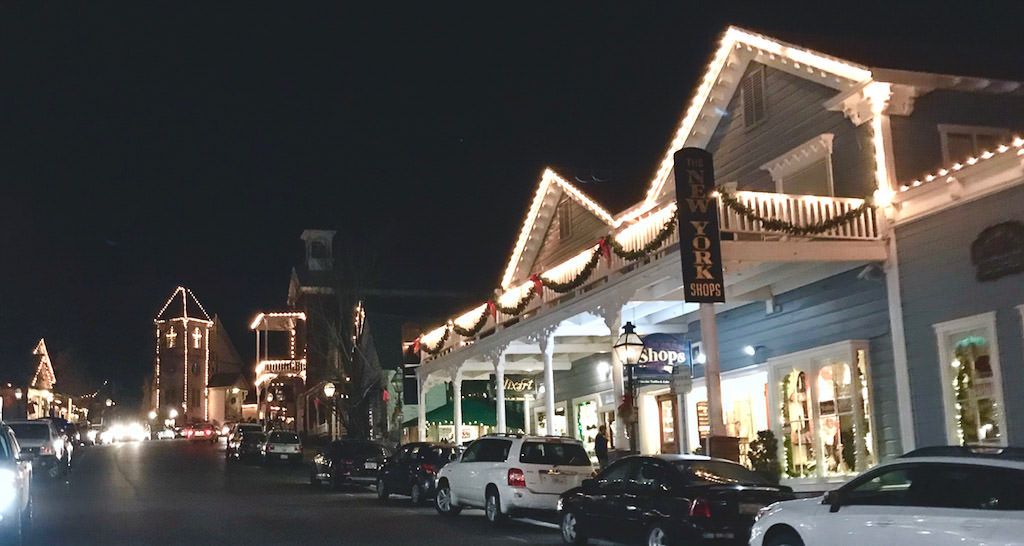 Downtown Nevada City lit up with Christmas lights at night.