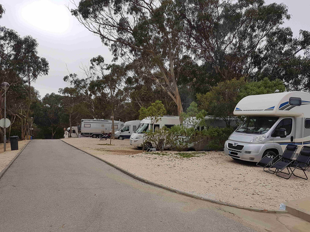 European campground with many motorhomes parked.