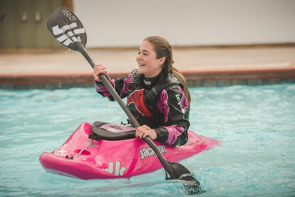 Abby Holcombe kayaking in the pool at the RVE Summit
