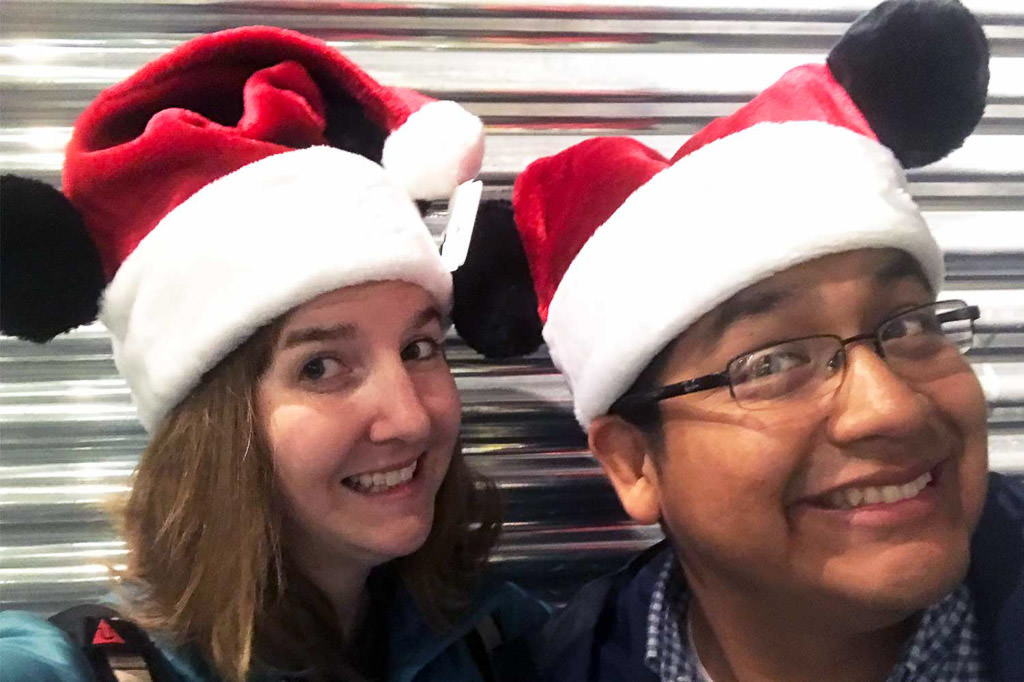 Katharine and Humberto in Mickey ear Santa hats