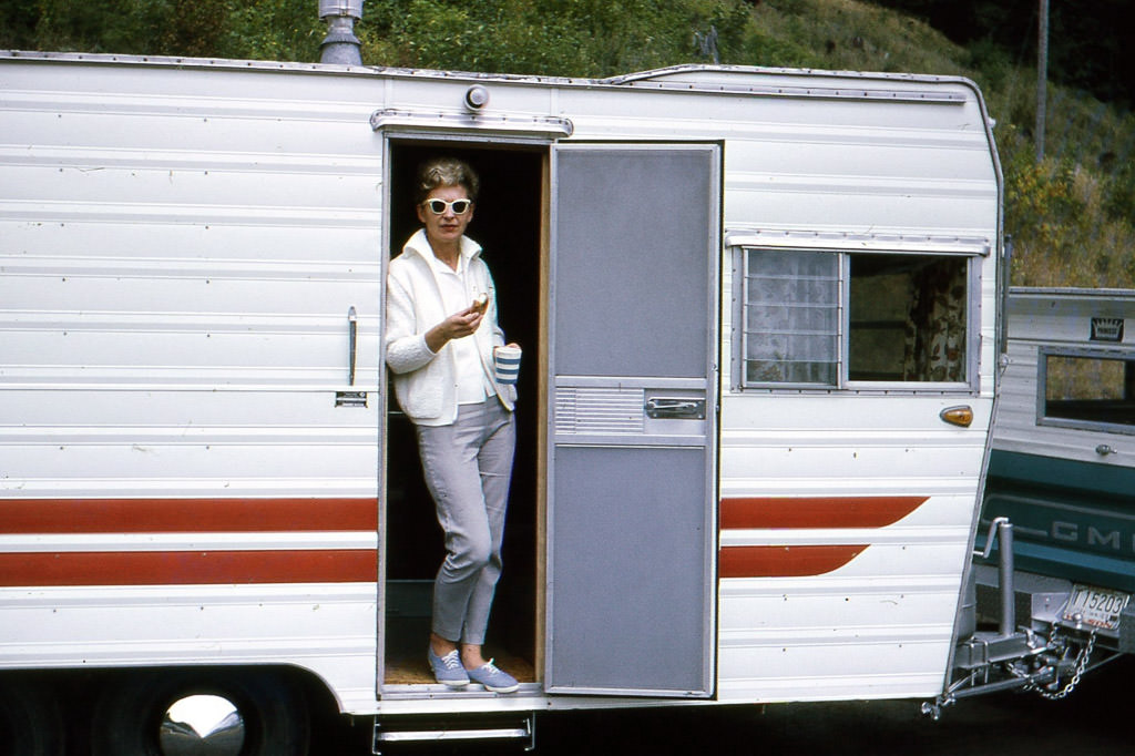 Rodney's grandma standing in doorway of a travel trailer