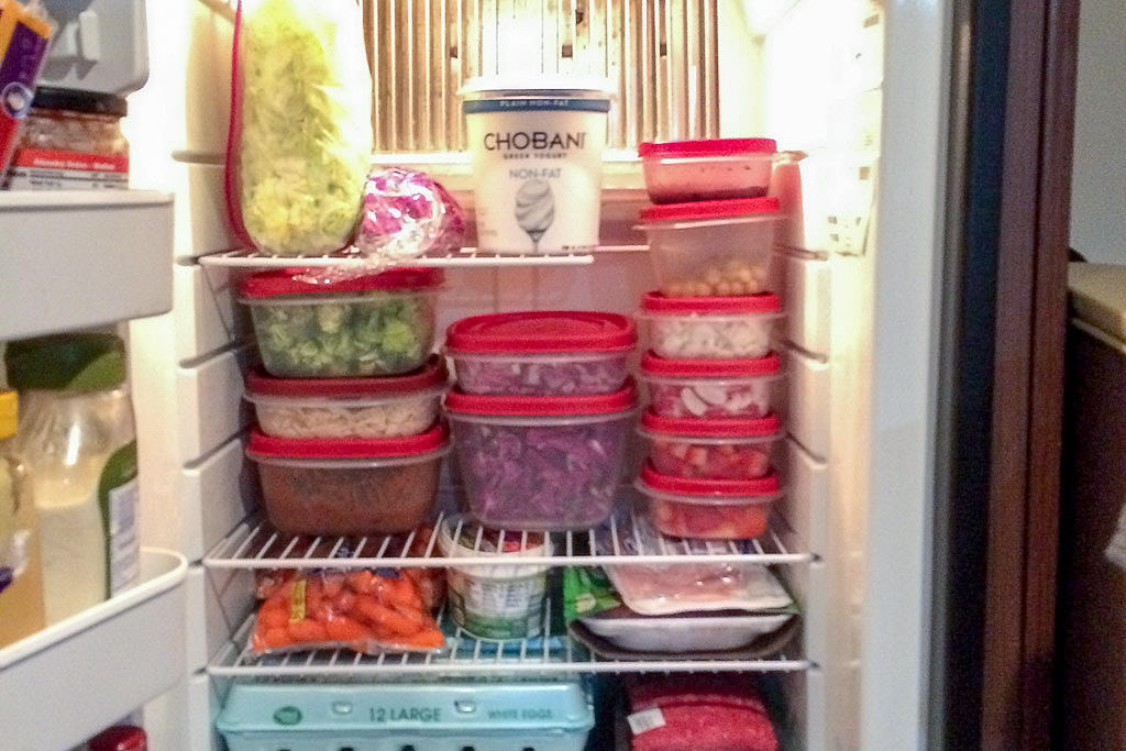 Fridge full of nicely stacked storage containers