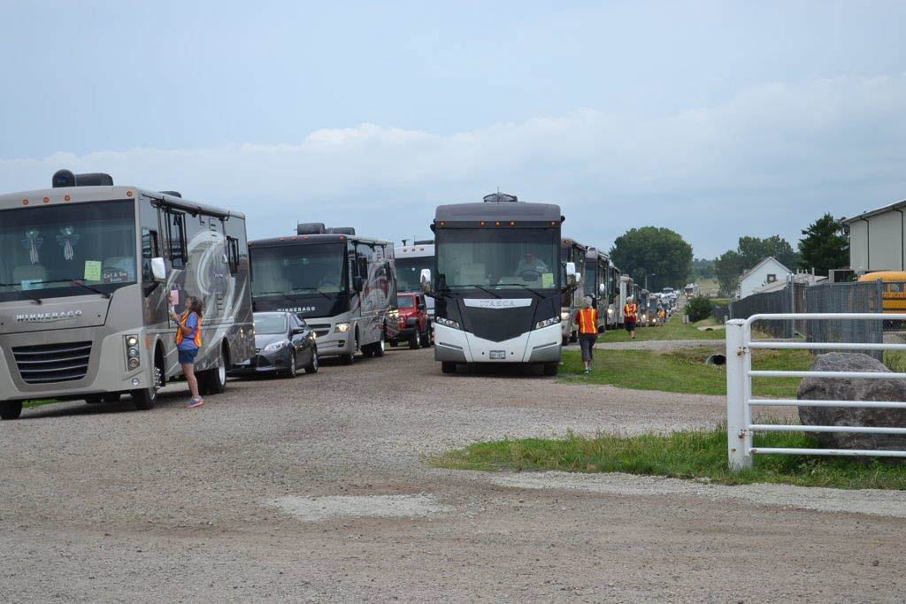 Lines of Winnebago motorhomes parked and waiting for entry into the Grand National Rally