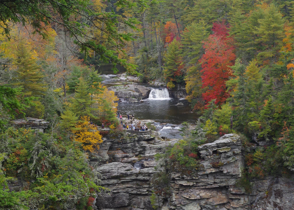 Linville waterfalls surrounded by colorful trees