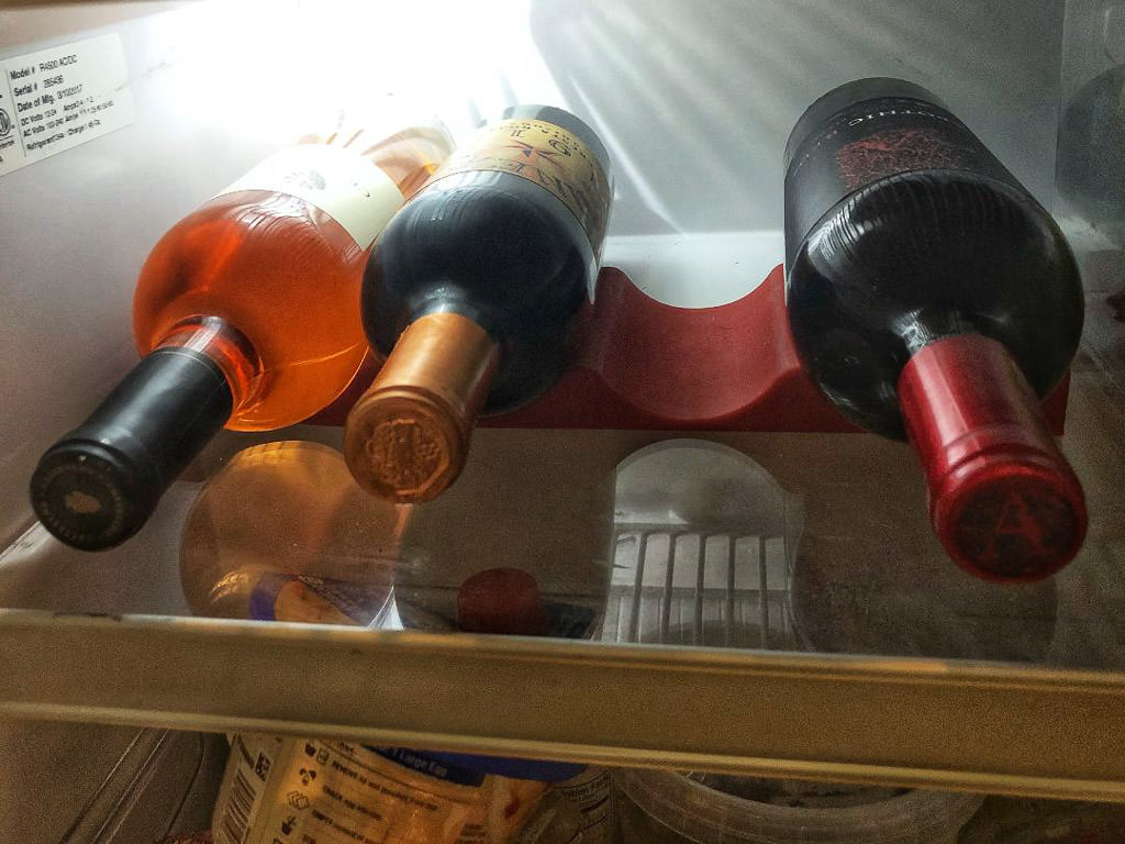 Example of wine stored on a wine shelf mat in a compact RV fridge 