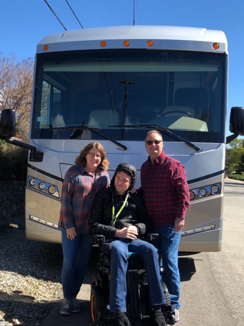 Cheri, Patrick and Mike in front of their Accessibility Enhanced Winnebago Forza.