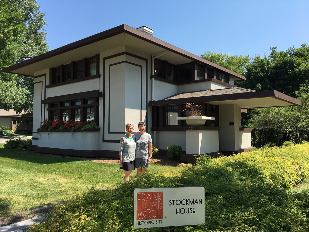 Noel and Chris standing in front of the Frank Lloyd Wright Stockman House.