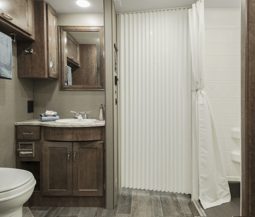 Roll-in bathroom and shower in 2019 Accessibility Enhanced Winnebago Adventurer.