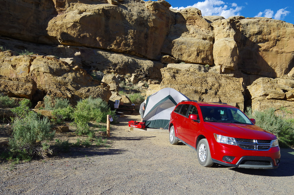 Car with tent set up behind it in front of rocks at Gallo Campground
