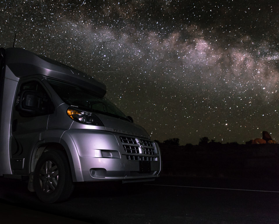 Front of a Winnebago Trend with star filled night sky above.