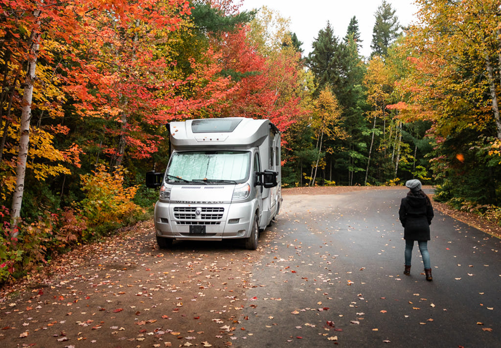 Winnebago Trend parked beneath trees changing color.