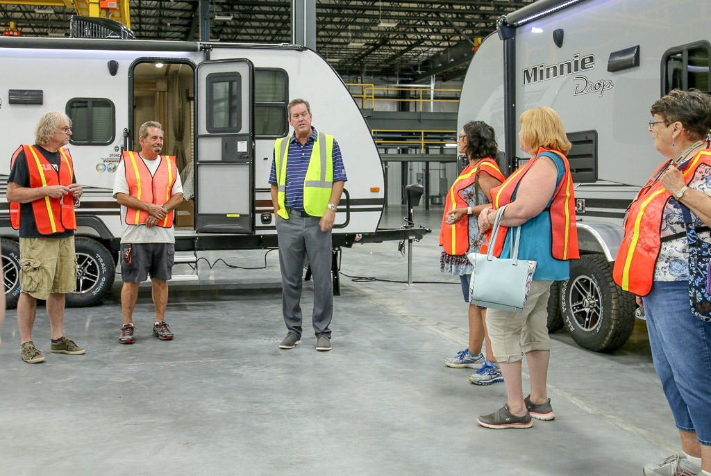 Scott Degnan, Winnebago Vice President, addressing the group doing a tour of the Towables facility.
